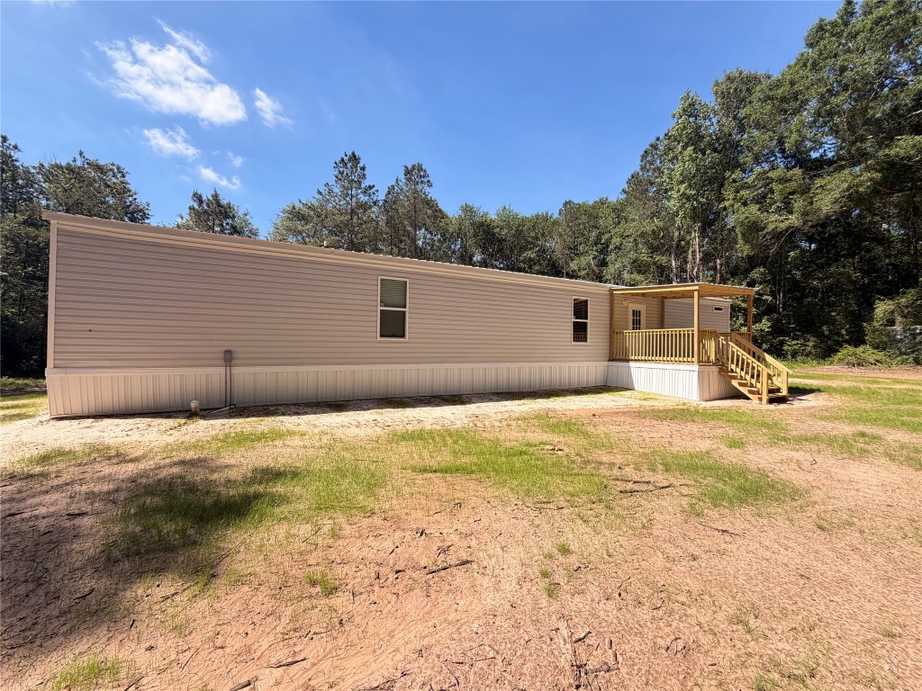 4782 Fm 1010 Road Cleveland, TX 77327 - Photo 2 of 16 a view of a house with a yard