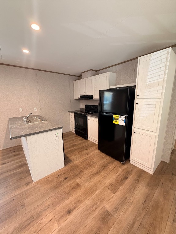 4782 Fm 1010 Road Cleveland, TX 77327 - Photo 5 of 16 a kitchen with a refrigerator and a stove top oven