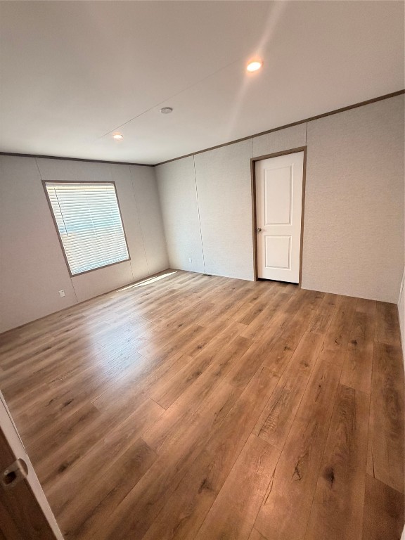 4782 Fm 1010 Road Cleveland, TX 77327 - Photo 10 of 16 an empty room with wooden floor and windows