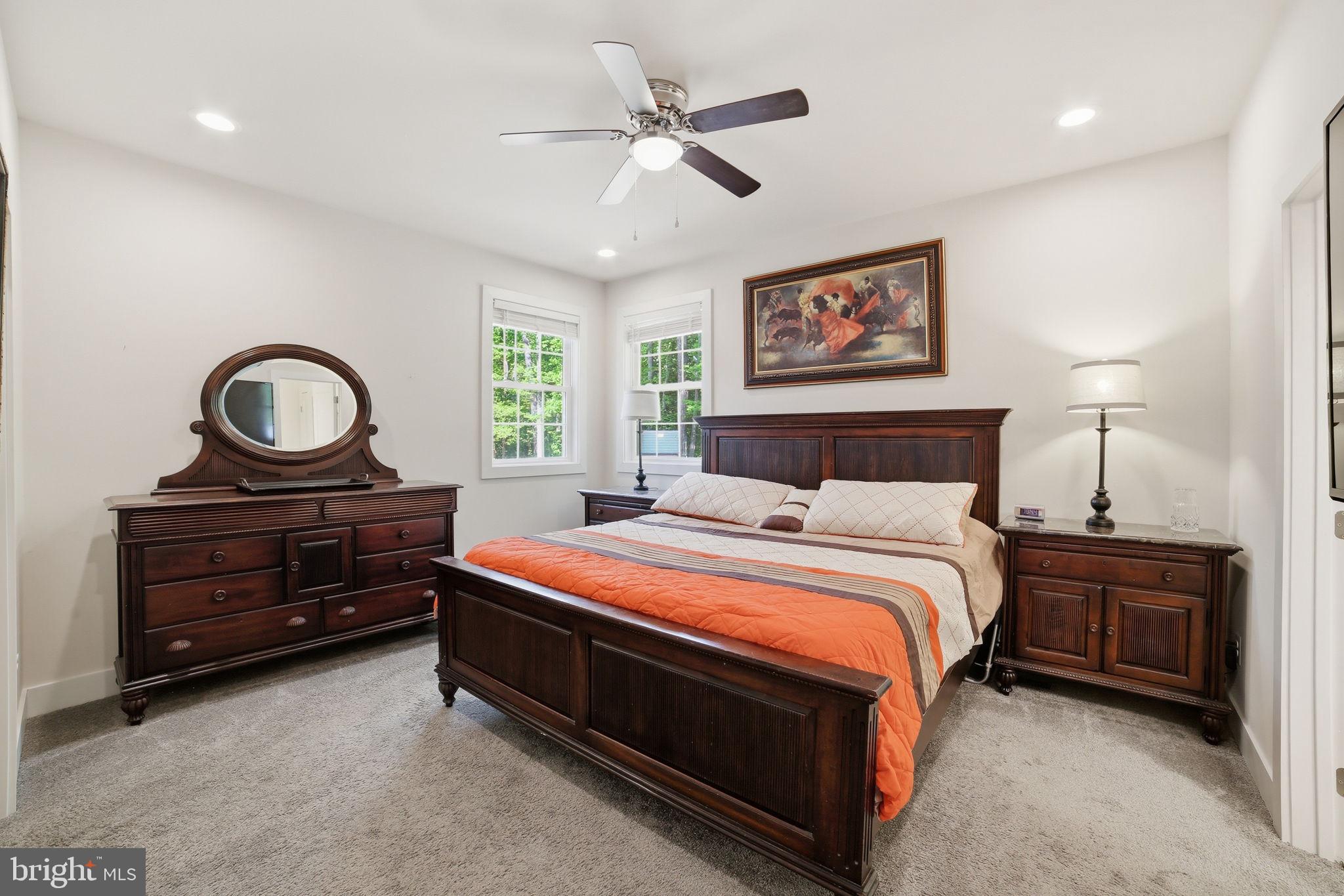 329 North Glebe Road Montross, VA 22520 - Photo 13 of 39 a bedroom with a bed and a chandelier