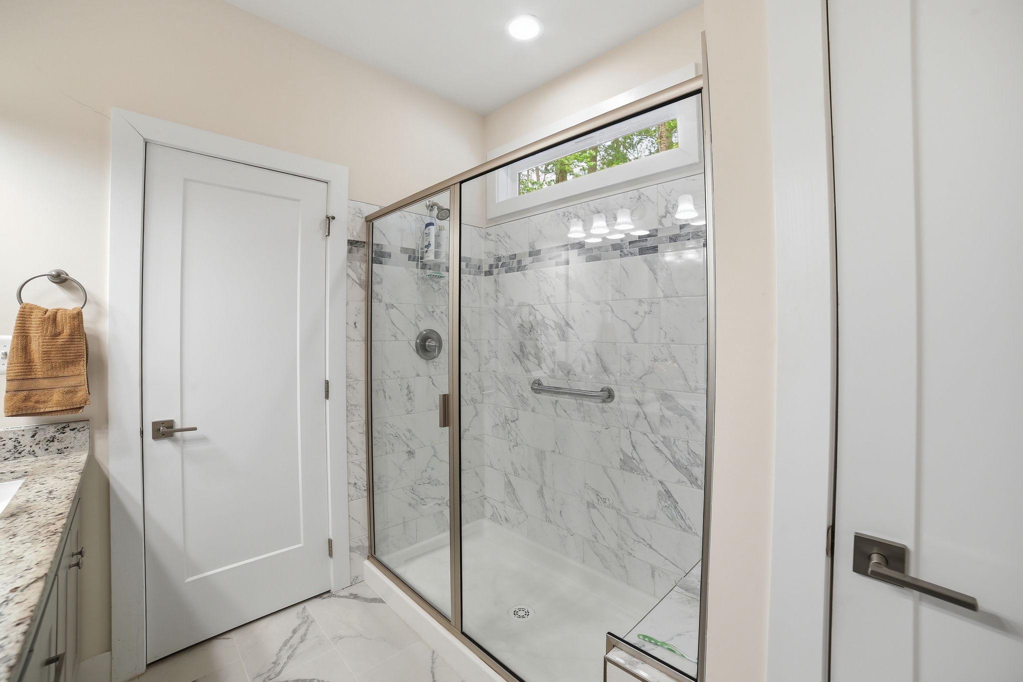 329 North Glebe Road Montross, VA 22520 - Photo 15 of 39 a bathroom with a glass shower door