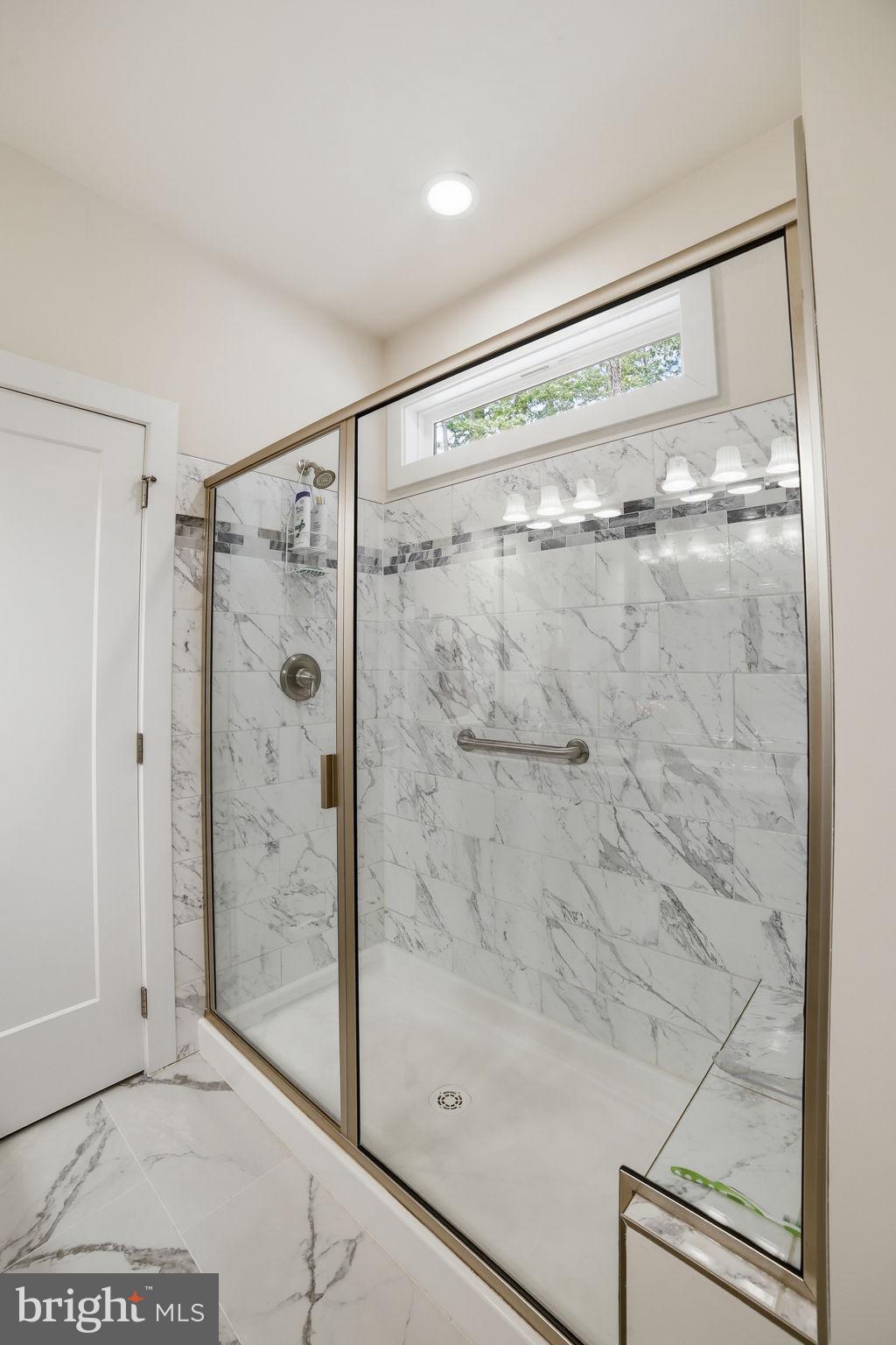 329 North Glebe Road Montross, VA 22520 - Photo 17 of 39 a bathroom with a glass shower door