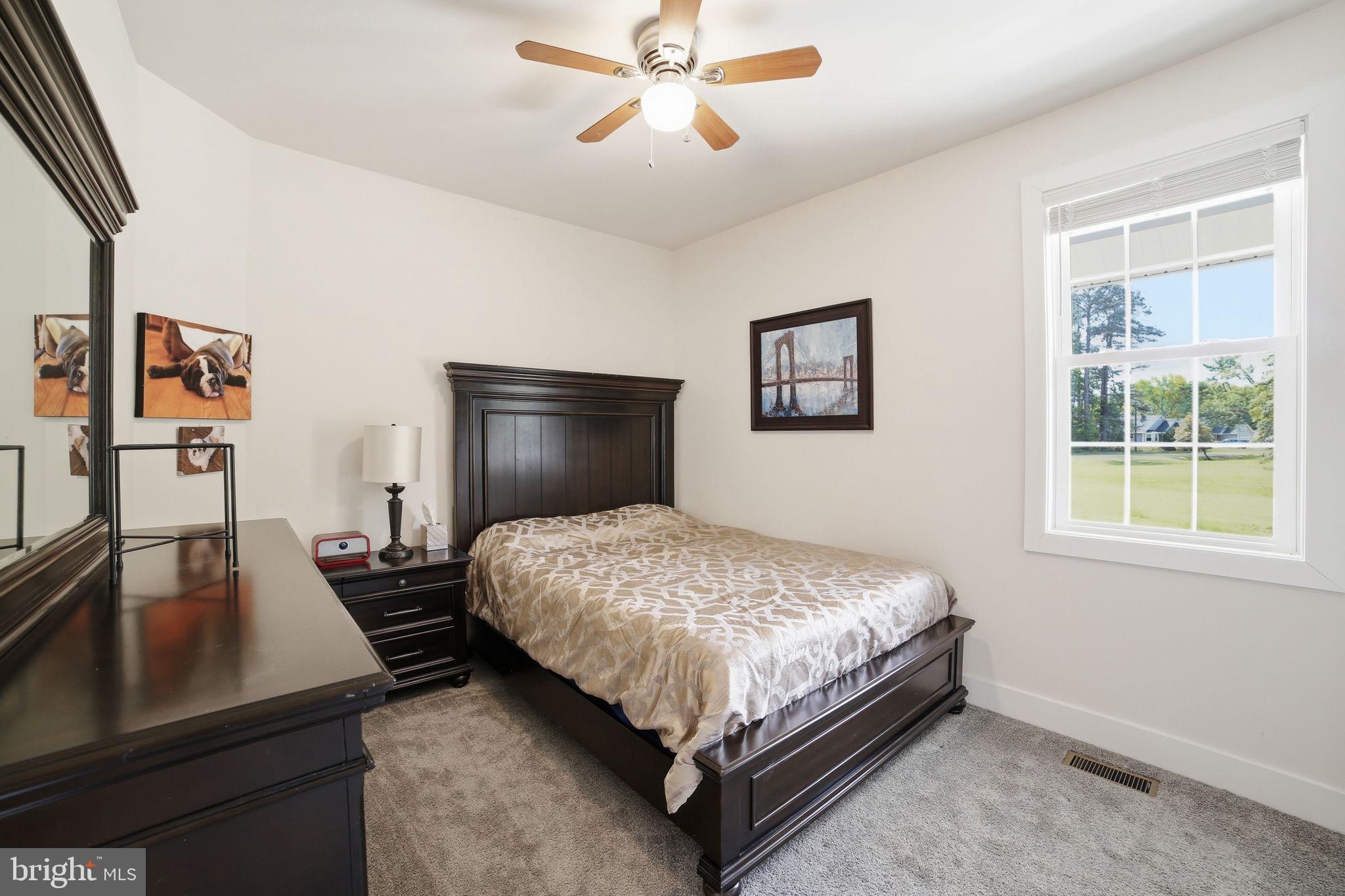 329 North Glebe Road Montross, VA 22520 - Photo 18 of 39 a bedroom with a bed and window