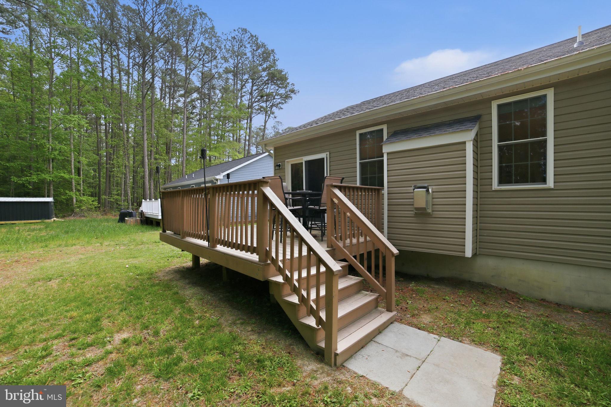 329 North Glebe Road Montross, VA 22520 - Photo 23 of 39 a view of a house with a yard and a wooden deck