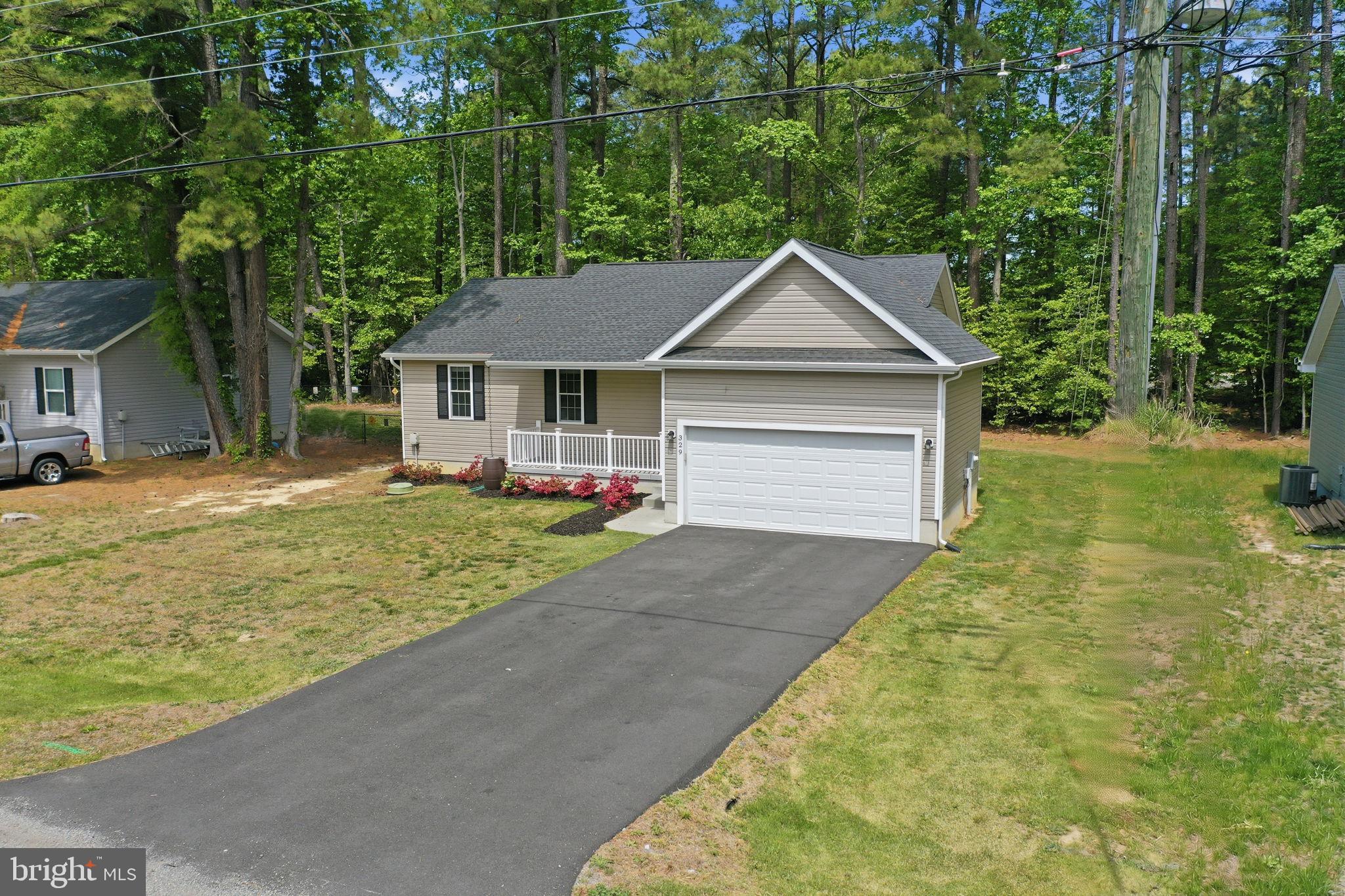329 North Glebe Road Montross, VA 22520 - Photo 7 of 39 a front view of a house with garden