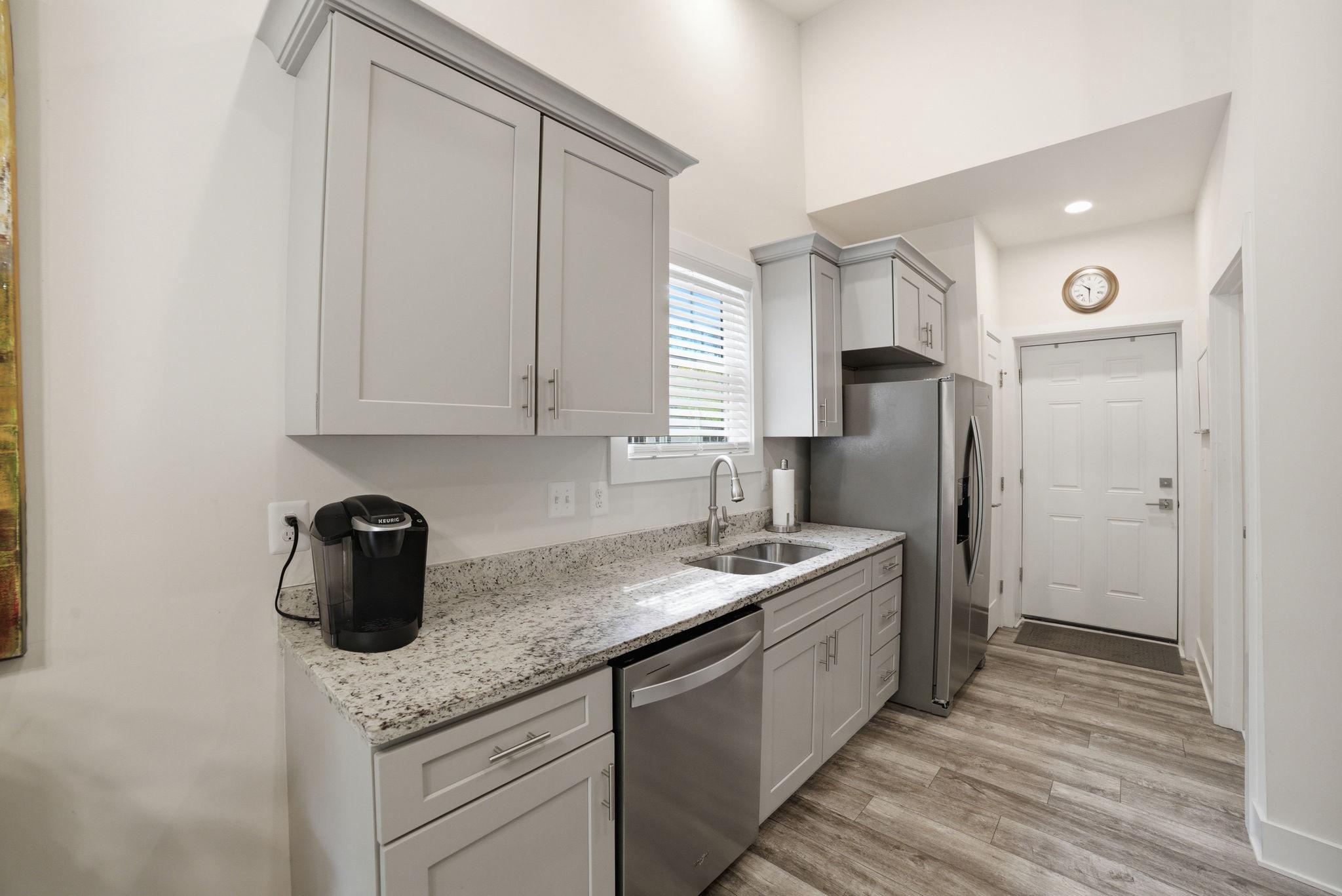 329 North Glebe Road Montross, VA 22520 - Photo 10 of 39 a kitchen with stainless steel appliances granite countertop a sink stove and refrigerator