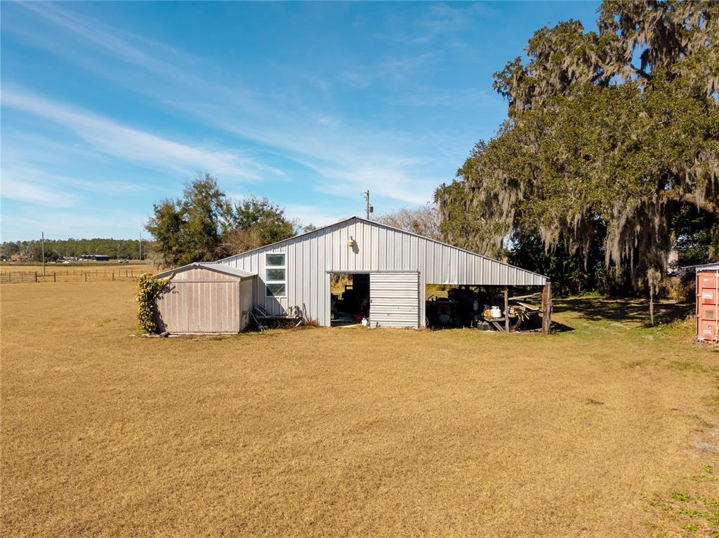 9504 Fort King Road Dade City, FL 33525 - Photo 50 of 51 a front view of a house with a yard