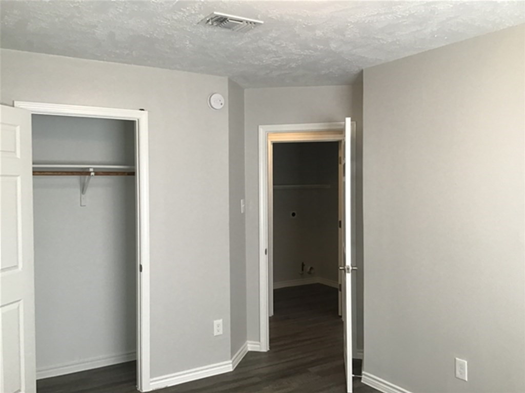 5026 Chase Stone Drive Bacliff, TX 77518 - Photo 13 of 18 a view of a hallway with wooden floor