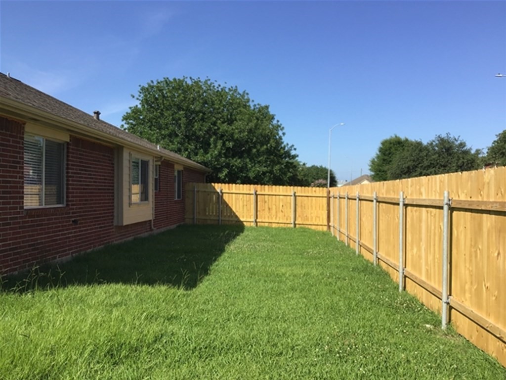 5026 Chase Stone Drive Bacliff, TX 77518 - Photo 17 of 18 a view of backyard with green space