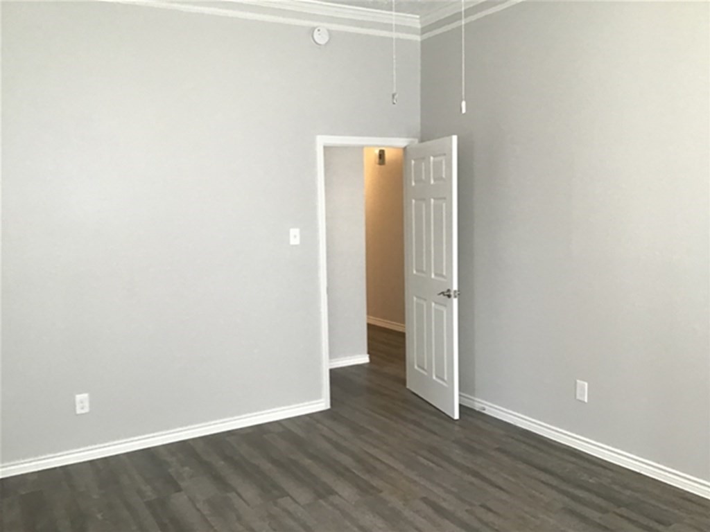 5026 Chase Stone Drive Bacliff, TX 77518 - Photo 5 of 18 a view of an empty room with wooden floor