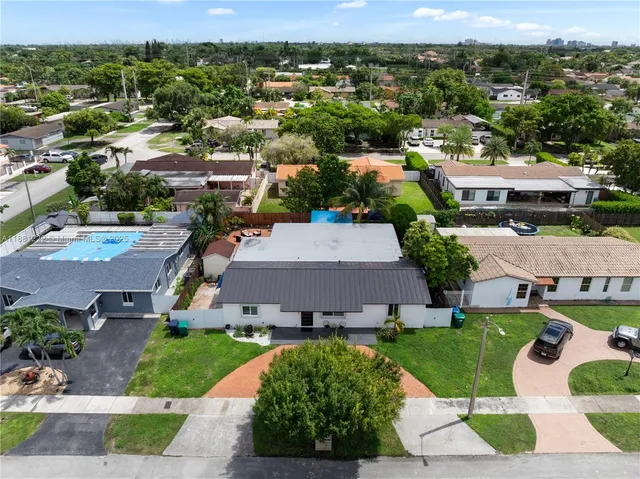 an aerial view of a house with a garden