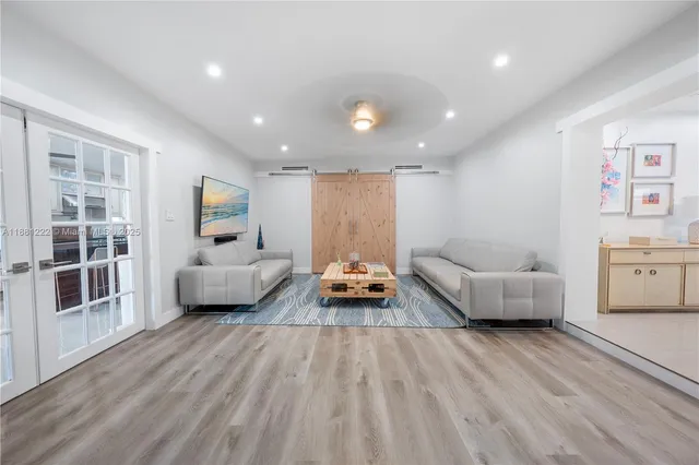 a lobby with furniture and a potted plant