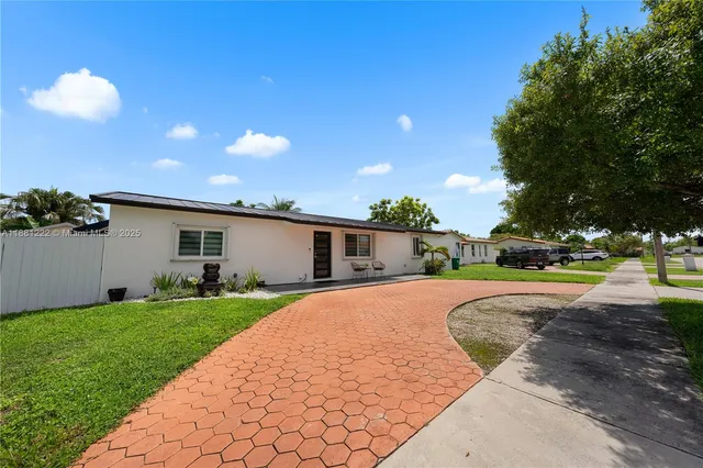 a view of a backyard of the house