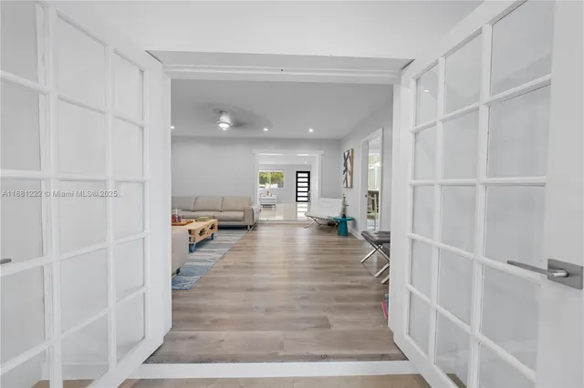 a living room with furniture a dining table and kitchen view