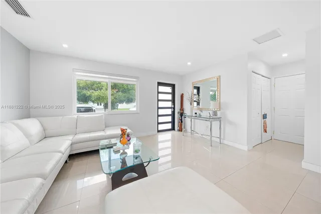 a spacious bathroom with a granite countertop sink mirror and vanity