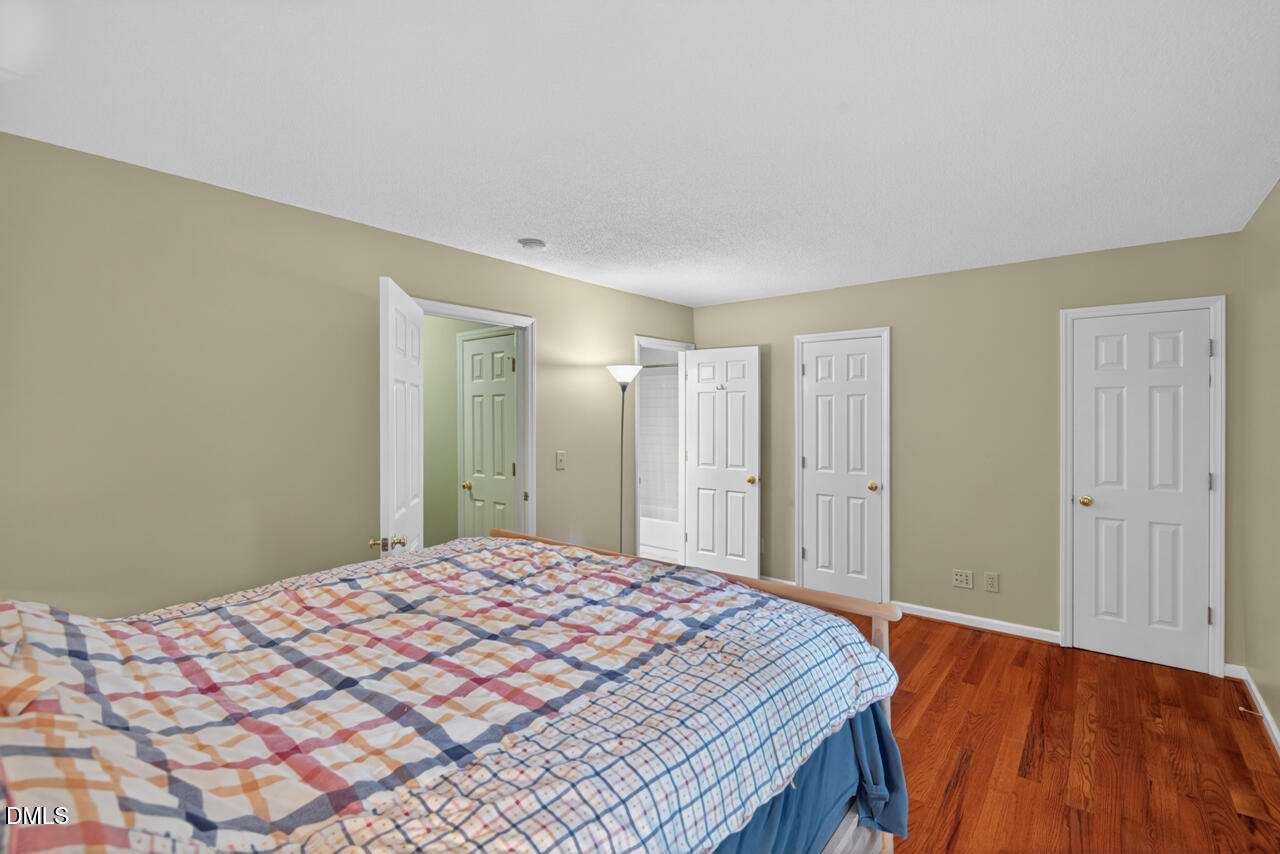 3307 Coachman's Way Durham, NC 27705 - Photo 30 of 50 a bedroom with a bed and a dresser