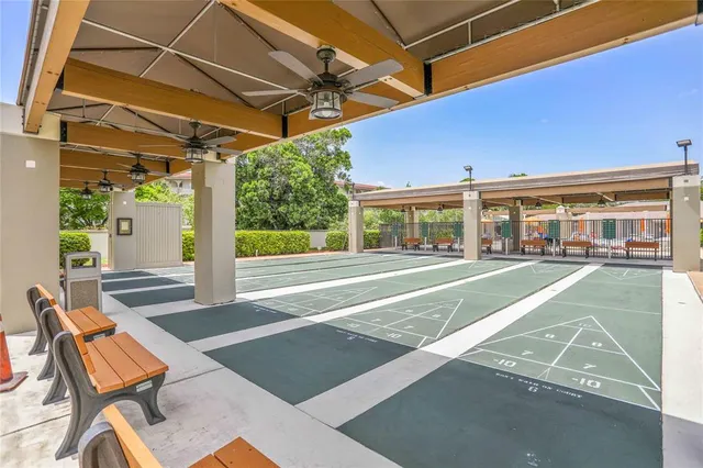 a view of a patio with table and chairs under an umbrella