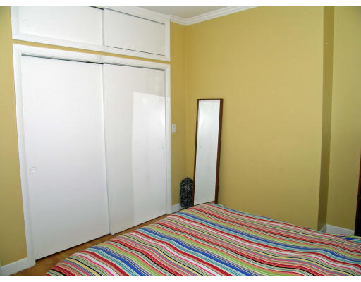 15 University Road, Unit 44 Brookline, MA 02445 - Photo 8 of 12 a bedroom with a bed and wooden floor