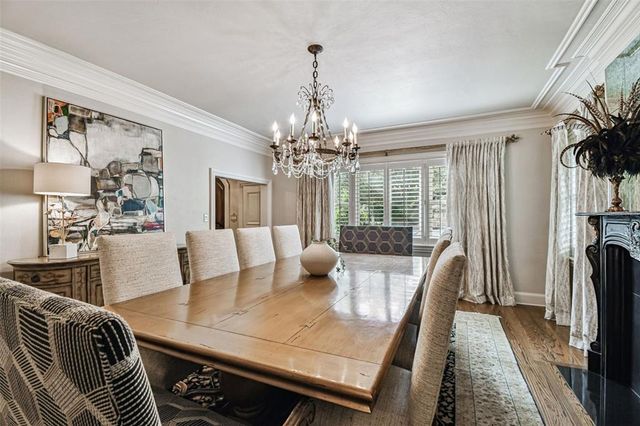 a bathroom with a granite countertop sink a mirror and a shower