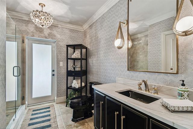 a en suite bathroom with a sink and a mirror
