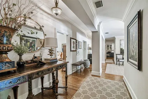 a bedroom with a bed and ceiling fan