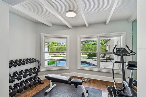 a bathroom with a granite countertop sink toilet a large mirror a shower and a bathtub