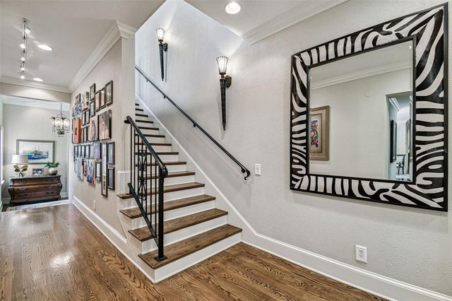 a bathroom with a granite countertop sink mirror vanity and toilet