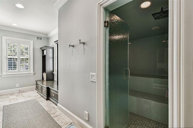 a room with furniture a chandelier and a window