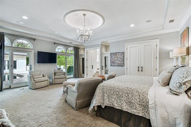 a living room with furniture projector and a flat screen tv