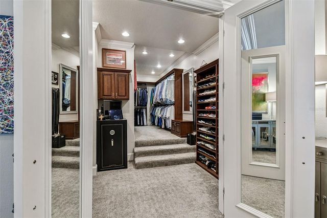 a kitchen with stainless steel appliances granite countertop a refrigerator and wooden cabinets