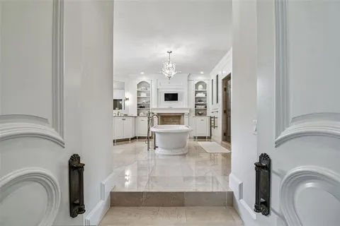 a kitchen with stainless steel appliances granite countertop a sink a stove and a wooden floors