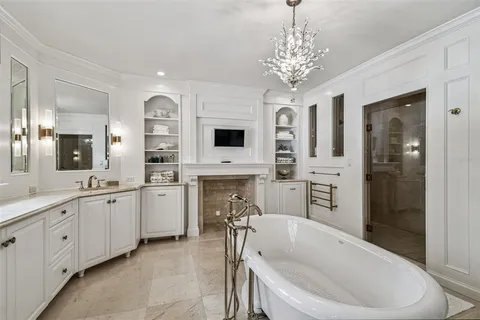 a kitchen with a sink a stove and chairs