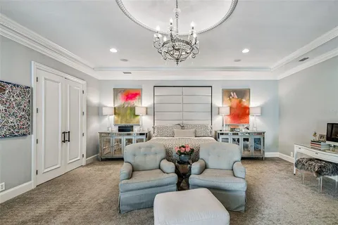 a view of a house with pool and chairs