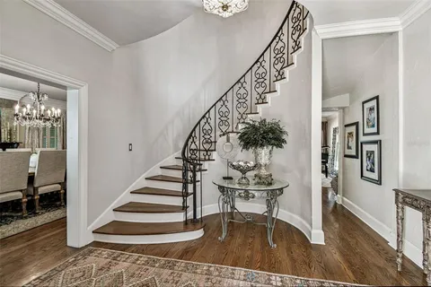 a living room with furniture a table and a large window