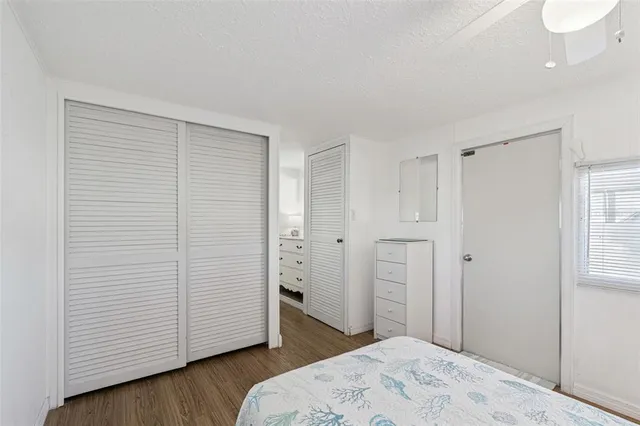 a bedroom with a bed and a bathroom