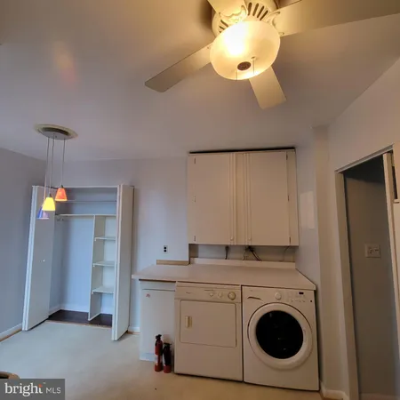 a kitchen with a stove and a refrigerator