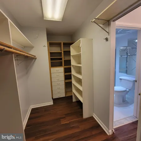 a bathroom with a shower toilet and sink