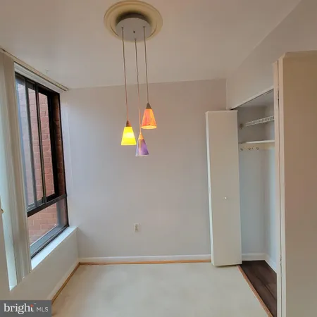 a utility room with cabinets and washer dryer