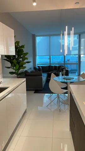 a kitchen with a sink and a stove