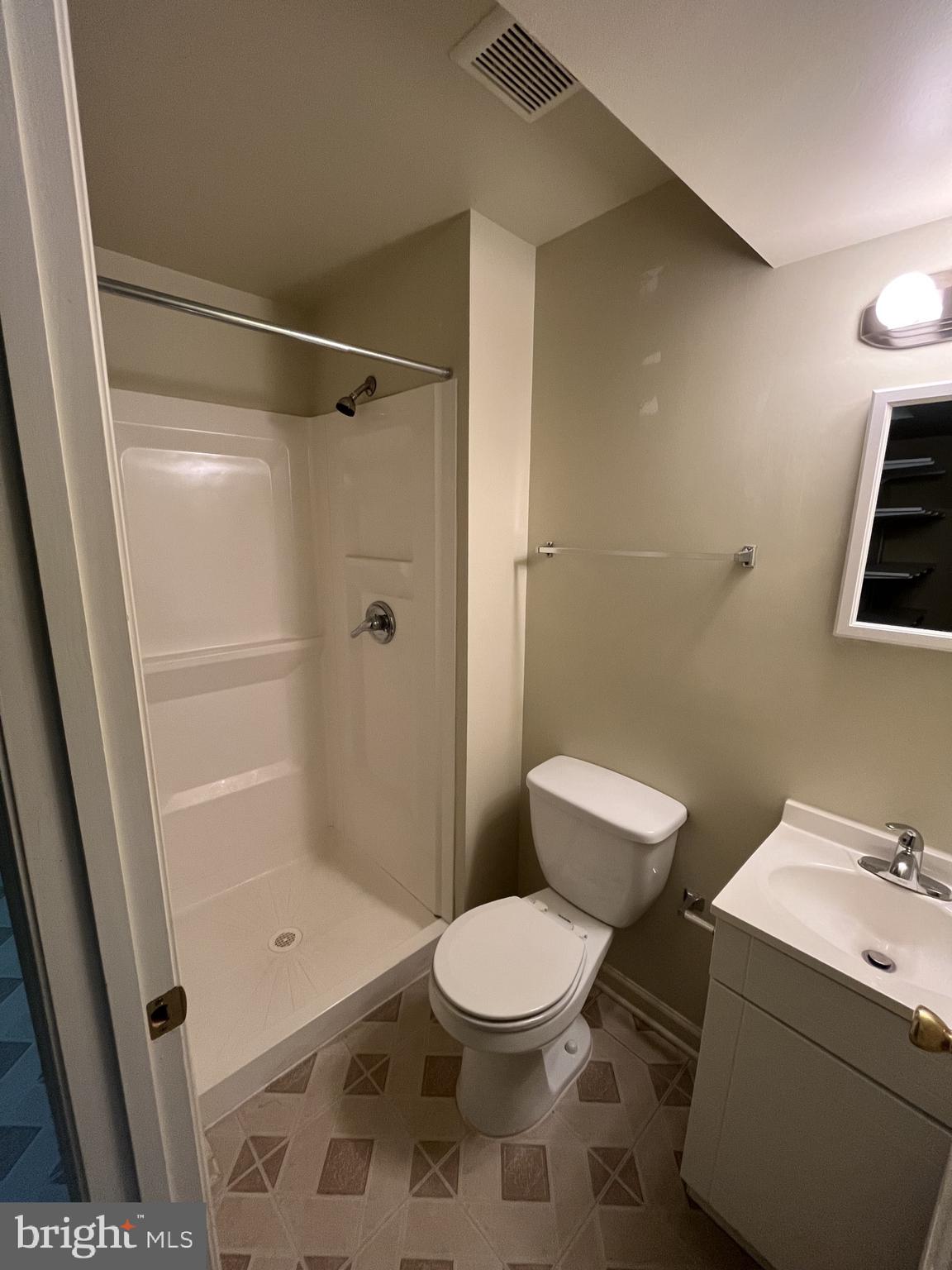 1463 Mobley Court Frederick, MD 21701 - Photo 21 of 32 a bathroom with a toilet a sink and shower