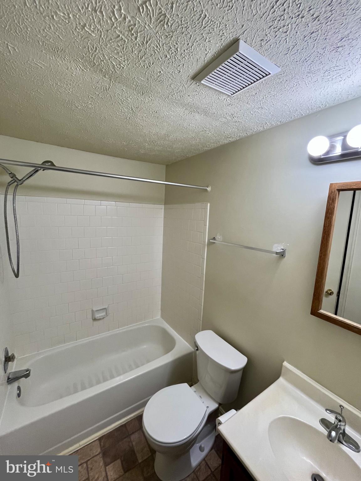 1463 Mobley Court Frederick, MD 21701 - Photo 23 of 32 a bathroom with a toilet a sink and bathtub