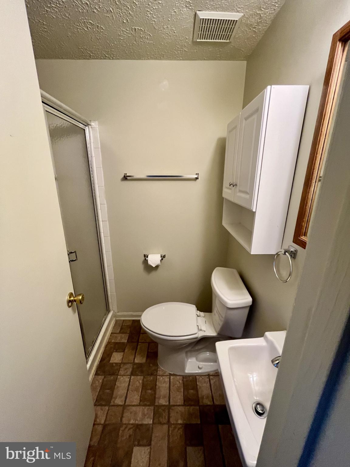 1463 Mobley Court Frederick, MD 21701 - Photo 26 of 32 a bathroom with a toilet and a shower