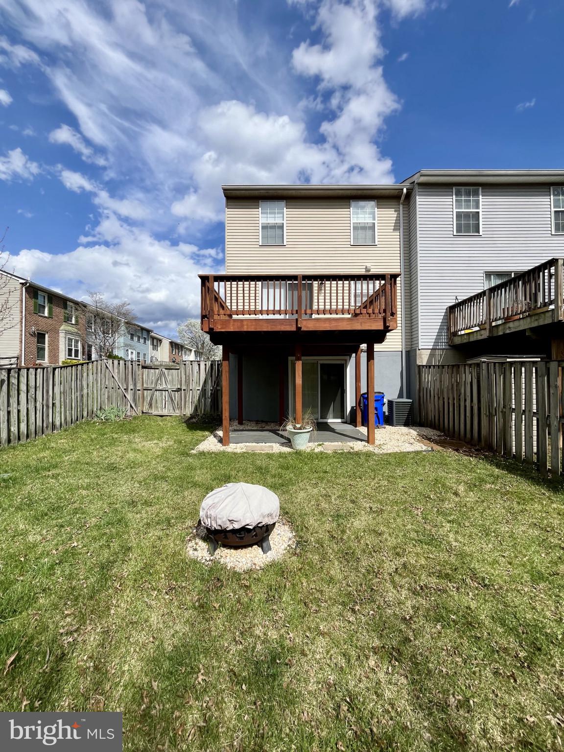 1463 Mobley Court Frederick, MD 21701 - Photo 7 of 32 a view of a house with a backyard and a yard