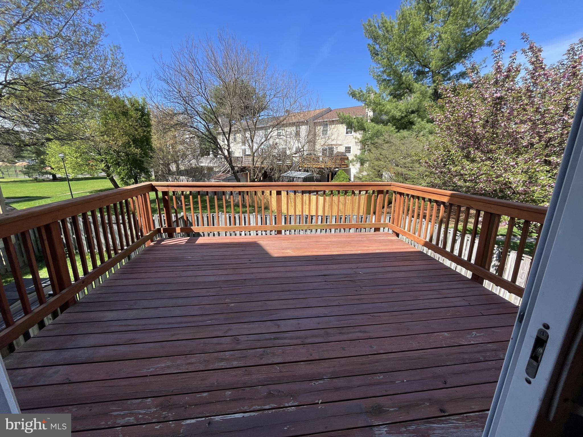 1463 Mobley Court Frederick, MD 21701 - Photo 8 of 32 a view of balcony with wooden floor and fence