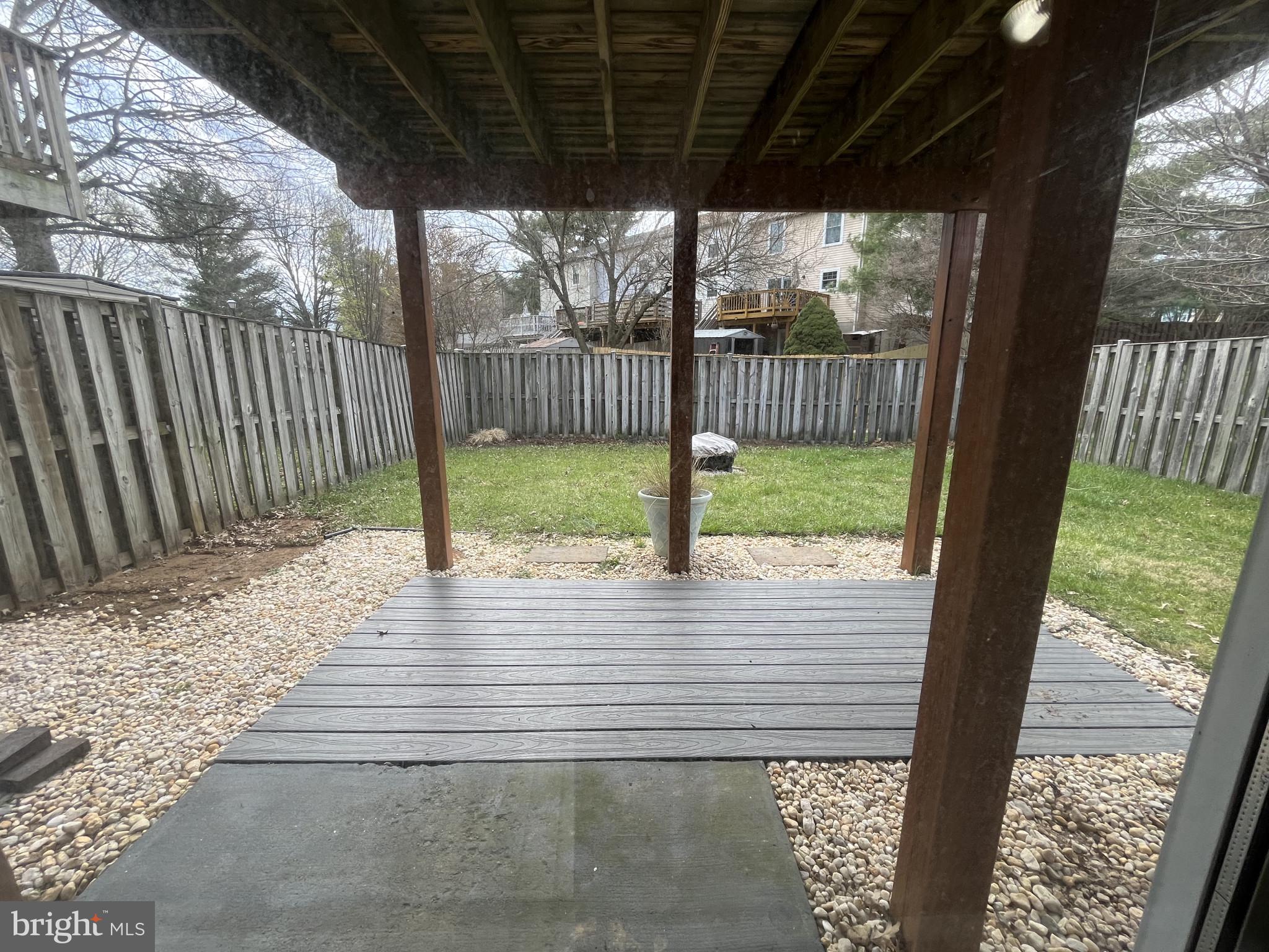 1463 Mobley Court Frederick, MD 21701 - Photo 9 of 32 a view of a porch with wooden floor and wooden fence