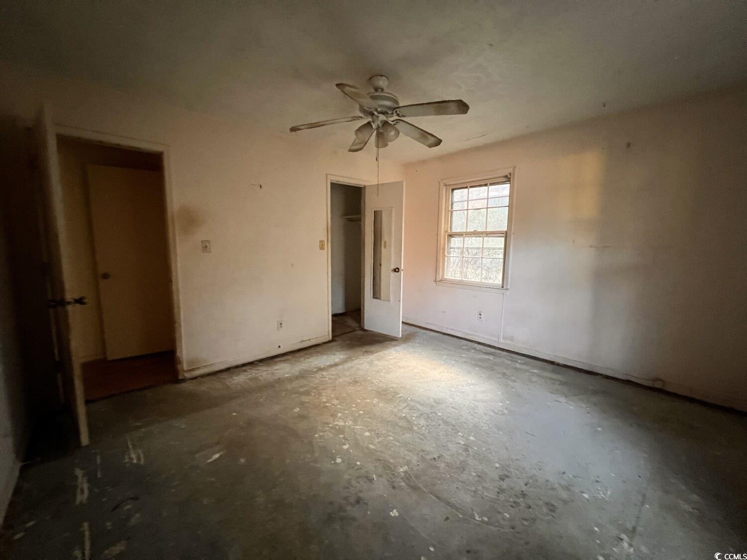 33 Plantation Road Myrtle Beach, SC 29588 - Photo 16 of 22 Unfurnished bedroom featuring a closet and a ceiling fan