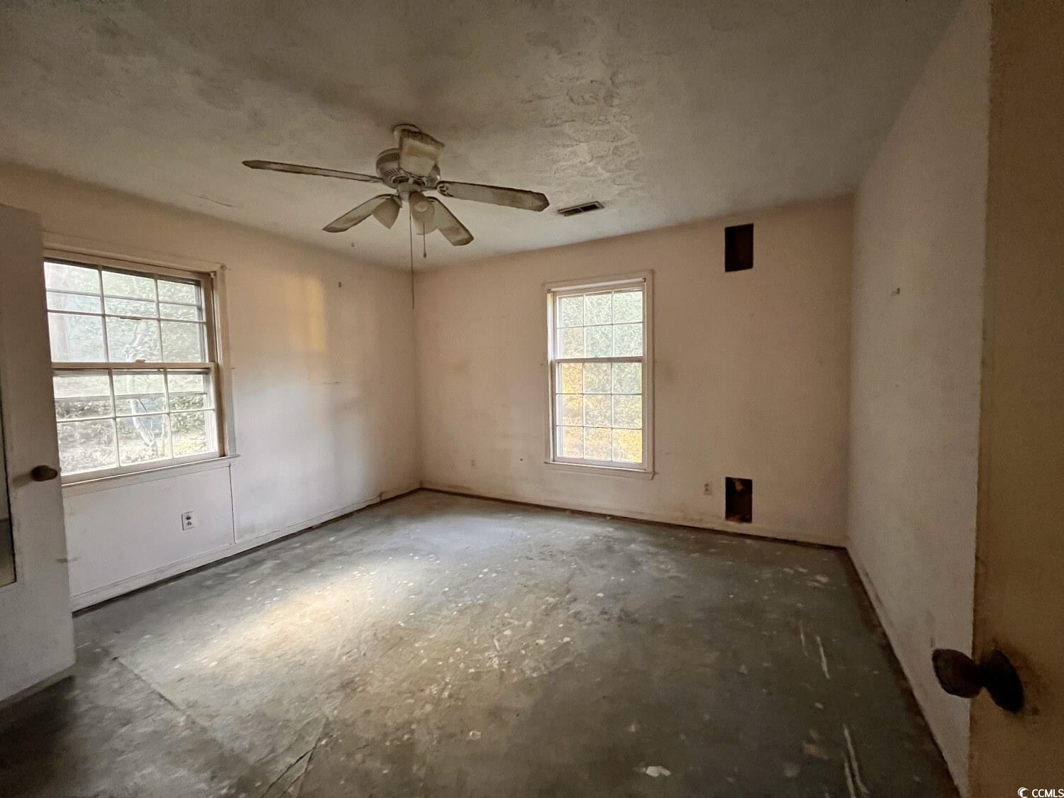 33 Plantation Road Myrtle Beach, SC 29588 - Photo 17 of 22 Unfurnished room featuring ceiling fan and a textured ceiling