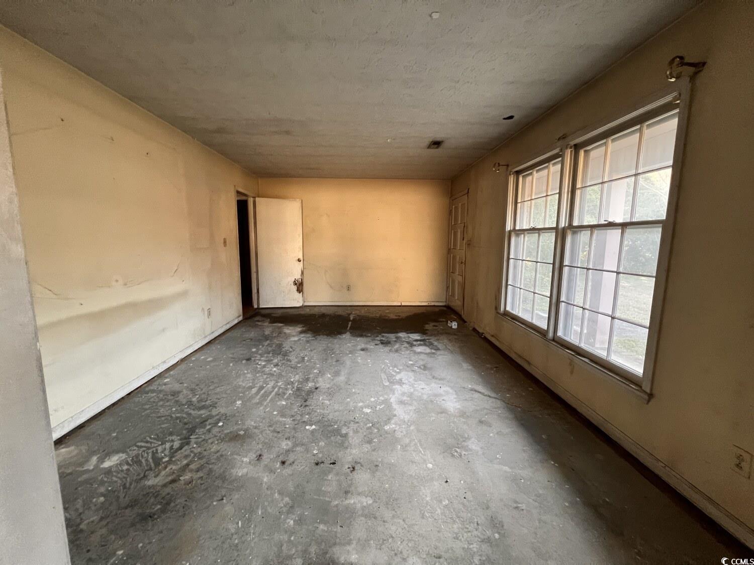 33 Plantation Road Myrtle Beach, SC 29588 - Photo 8 of 22 Unfurnished room featuring concrete floors