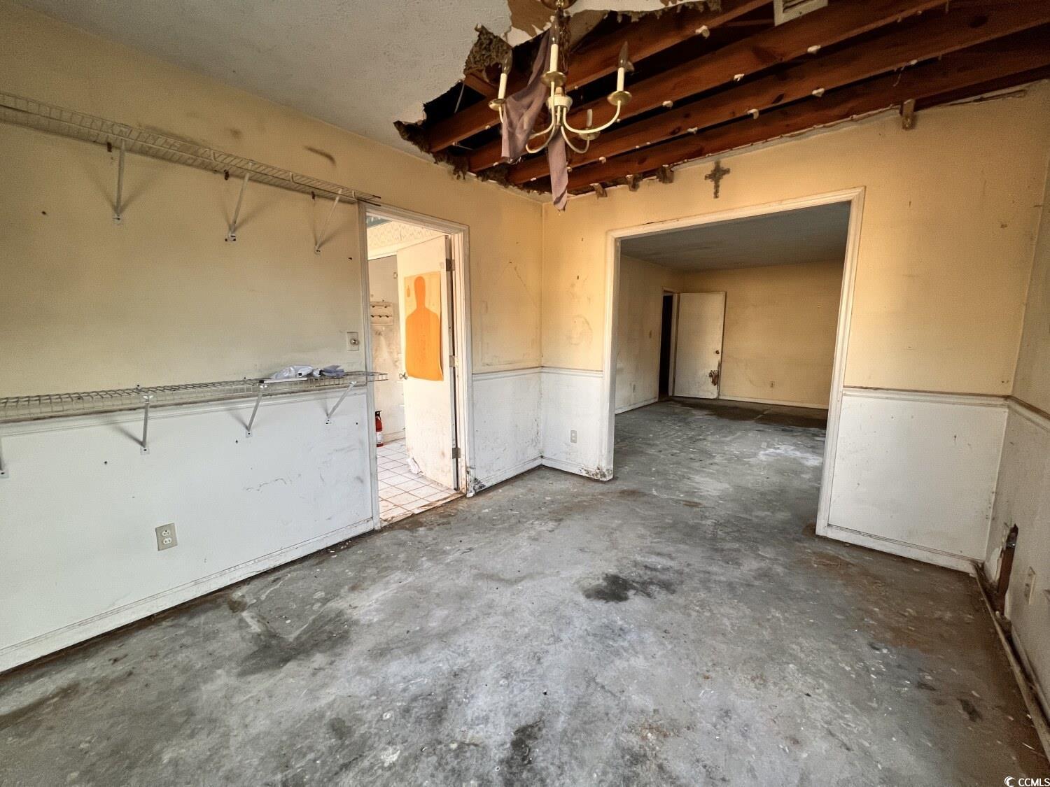 33 Plantation Road Myrtle Beach, SC 29588 - Photo 10 of 22 Unfurnished dining area with unfinished concrete floors