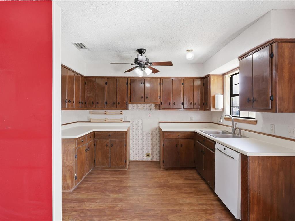 701 College Street Celeste, TX 75423 - Photo 10 of 29 a kitchen with stainless steel appliances granite countertop a sink stove and cabinets